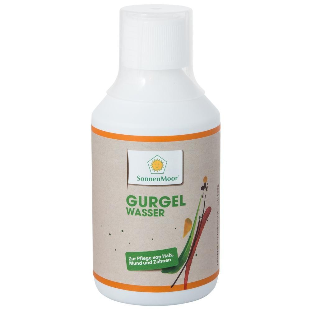 Eine Flasche Mundspülung mit orangefarbenem Etikett und grünem Schriftzug.